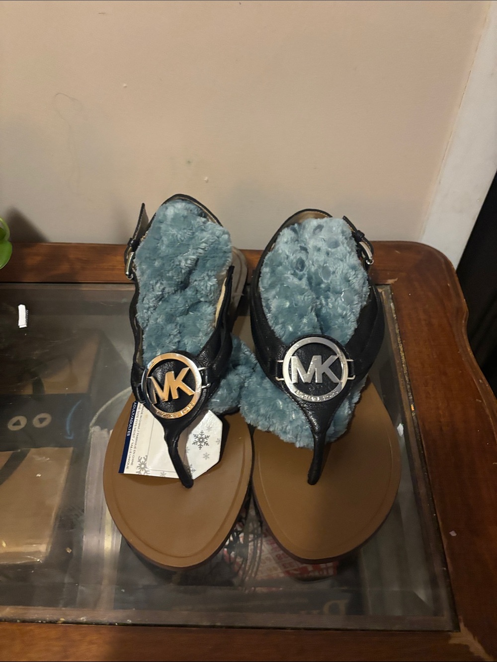 Michael Kors Black Thong Sandals with Blue Faux-Fur Footbed and MK Medallion